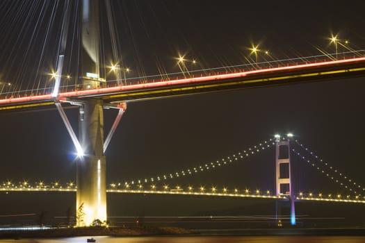 It is beautiful night scenes of Bridge in Hong Kong.