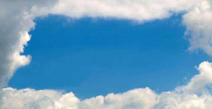 Sky with a nice frame of clouds with large copy space