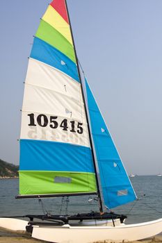 It is a close shot of windsurfer sailing