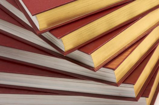 Burgundy Covered Stack of Books Close Up.