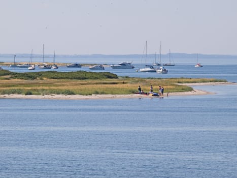 Dream vacation and beach fun - boats anchored on a beautiful beach