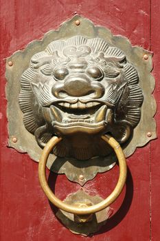 Close up of traditional oriental Chinese lion door knob