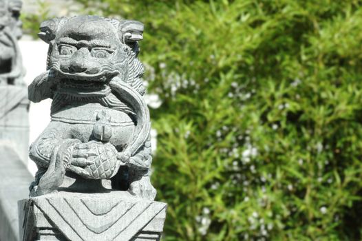 Traditional oriental chinese lion statue displaying power and strength