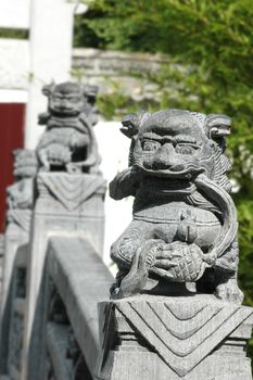 Traditional oriental chinese lion statue displaying power and strength