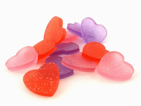 Several pink, purple and red hearts isolated on a white background