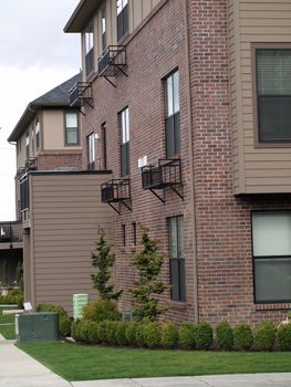 Apartment building with nice green landscaping around it