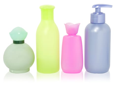 set of different colorful cosmetics bottles isolated over white with clipping path