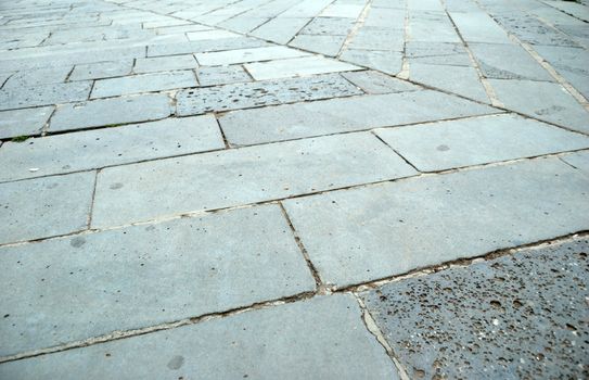close-up of new old-style pavement of bricks of grey color