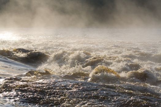 august foggy morning: river, foam; splashes
