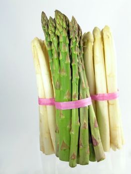  bunch of asparagus isolated on blue background