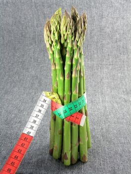  bunch of asparagus isolated on dark background