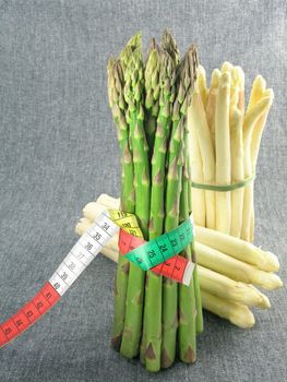  bunch of asparagus isolated on dark background