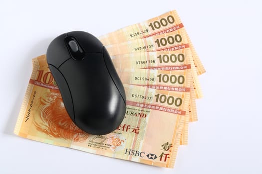 Using money online by a mouse.