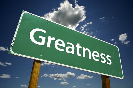 Greatness Road Sign with dramatic clouds and sky.