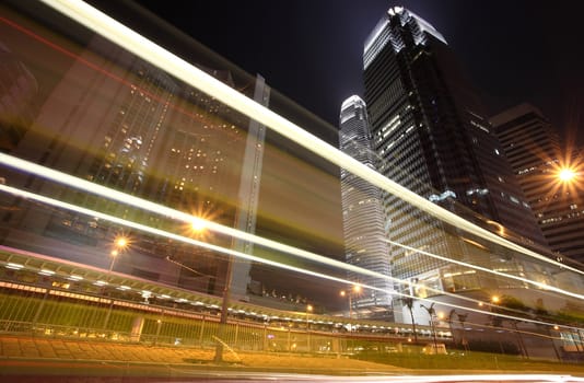 Skyscraper with traffic lights and cars motion in Hong Kong