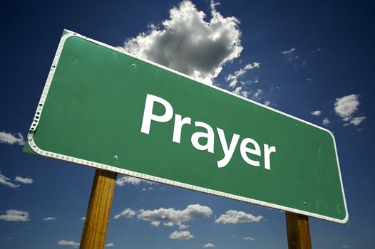 Prayer Road Sign with dramatic clouds and sky.