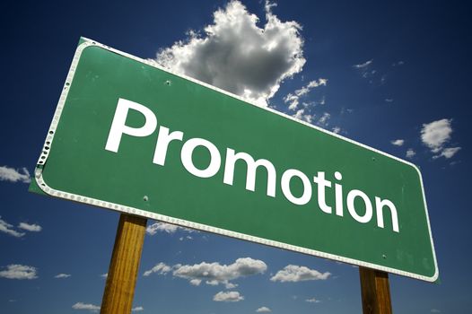 Promotion Road Sign with dramatic clouds and sky.