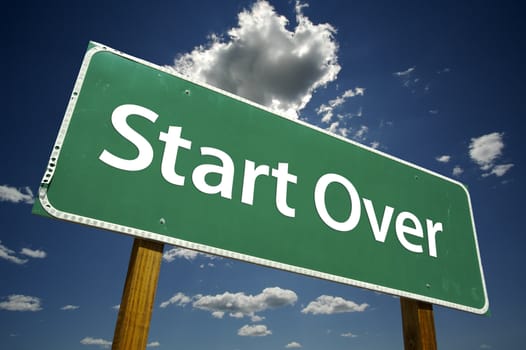 Start Over Road Sign with dramatic clouds and sky.