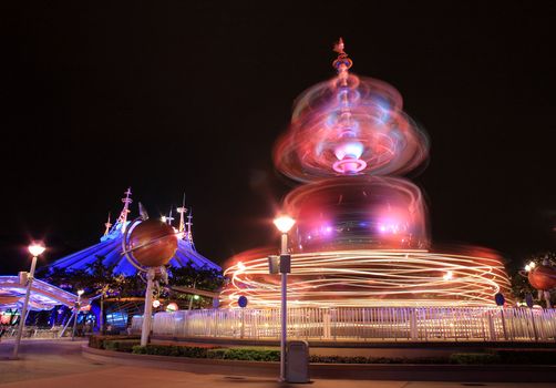 amusement park at night with light blur