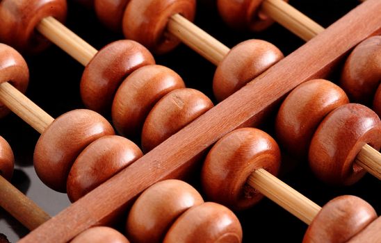 A closeup of abacus with black background