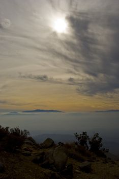 Mountain rises above thick fog