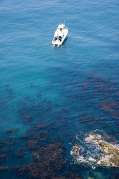 Boat of divers in coral reef