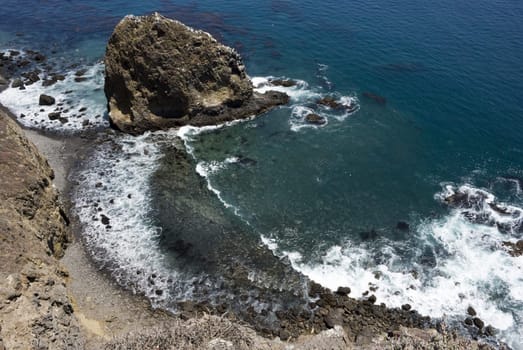 Waves hit the shore in a cove