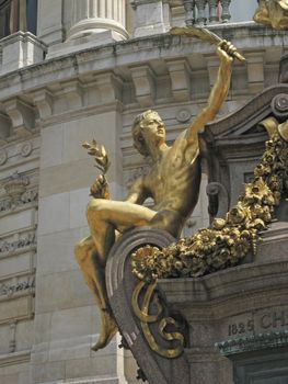 Golden statue in front of the opera Garnier in Paris