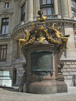 Golden statues in front of the opera Garnier in Paris
