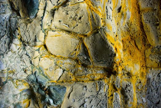 Yellow minerals on a rock formation