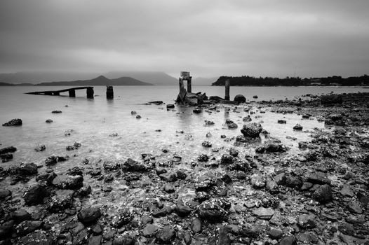 desolate and broken peer on the beach