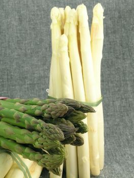  bunch of asparagus isolated on dark background