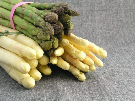  bunch of asparagus isolated on dark background