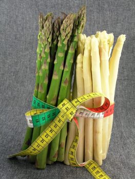  bunch of asparagus isolated on dark background