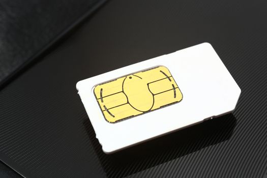 sim card on a black metal background