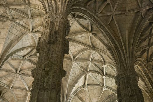 Rib-vaulted ceiling and columns in Jeronimos Monastery in Lisbon, Portugal.