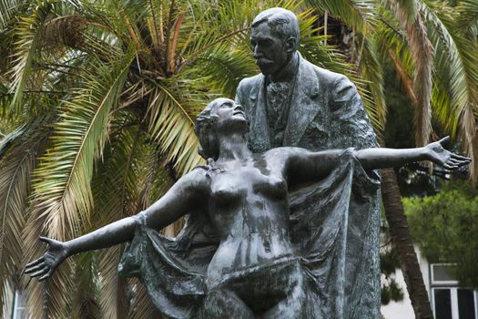 Statue of novelist Eca de Queiros with female muse in Lisbon, Portugal.