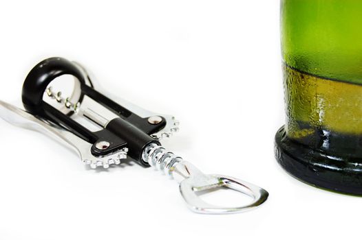 corkscrew and part of wine bottle