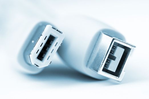 Extreme closeup of firewire cables showing differen connectors