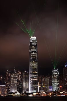 lights show in Hong Kong at night, with green laser light