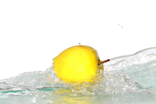 Yellow apple and splashing water isolated on white background with clipping path