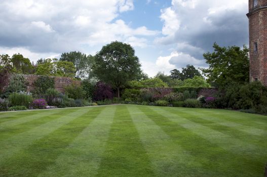 A cottage garden with an herbaceous border