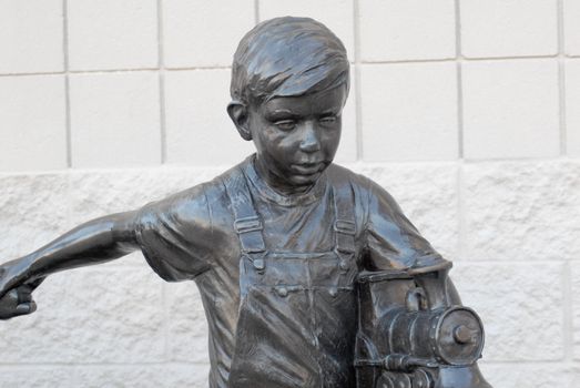 Bronze Boy Playing With Train