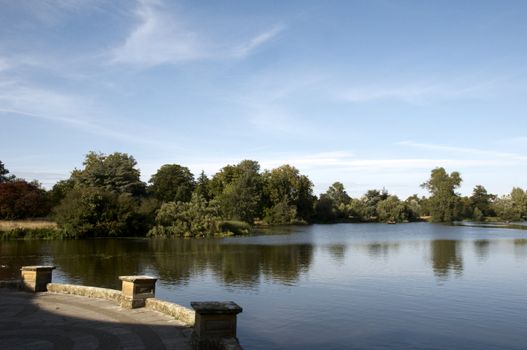 A lake in summer with trees in the background