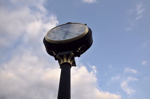 vintage looking watch in a square looking at the sky