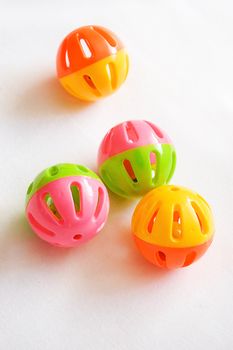 Round colorful rattles on white