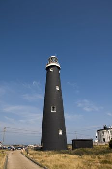 A black lighthouse at Dungeness , Kent