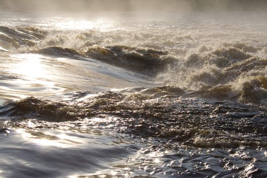 august foggy morning: river, foam; splashes
