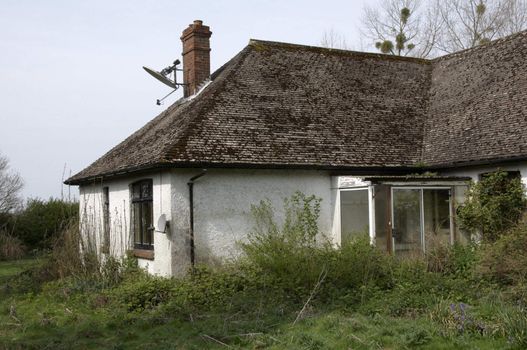 An old run-down and abandoned bungalow in the English countryside