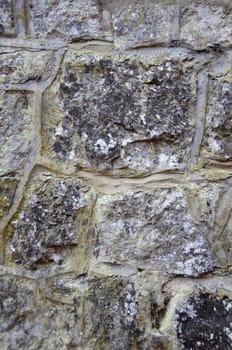 A detail of an old stone wall